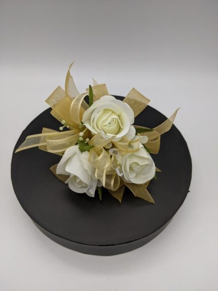 white roses with gold ribbon