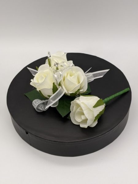 white roses with white organza ribbon